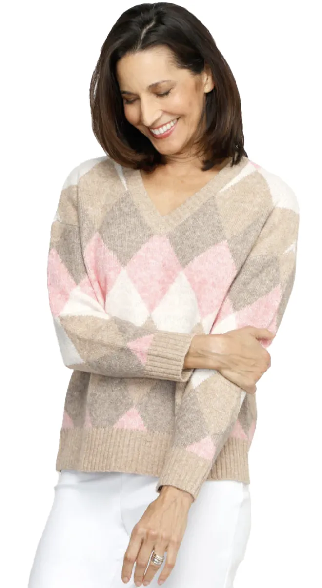 A Ninety Clothing Co. argyle sweater in soft pink and beige