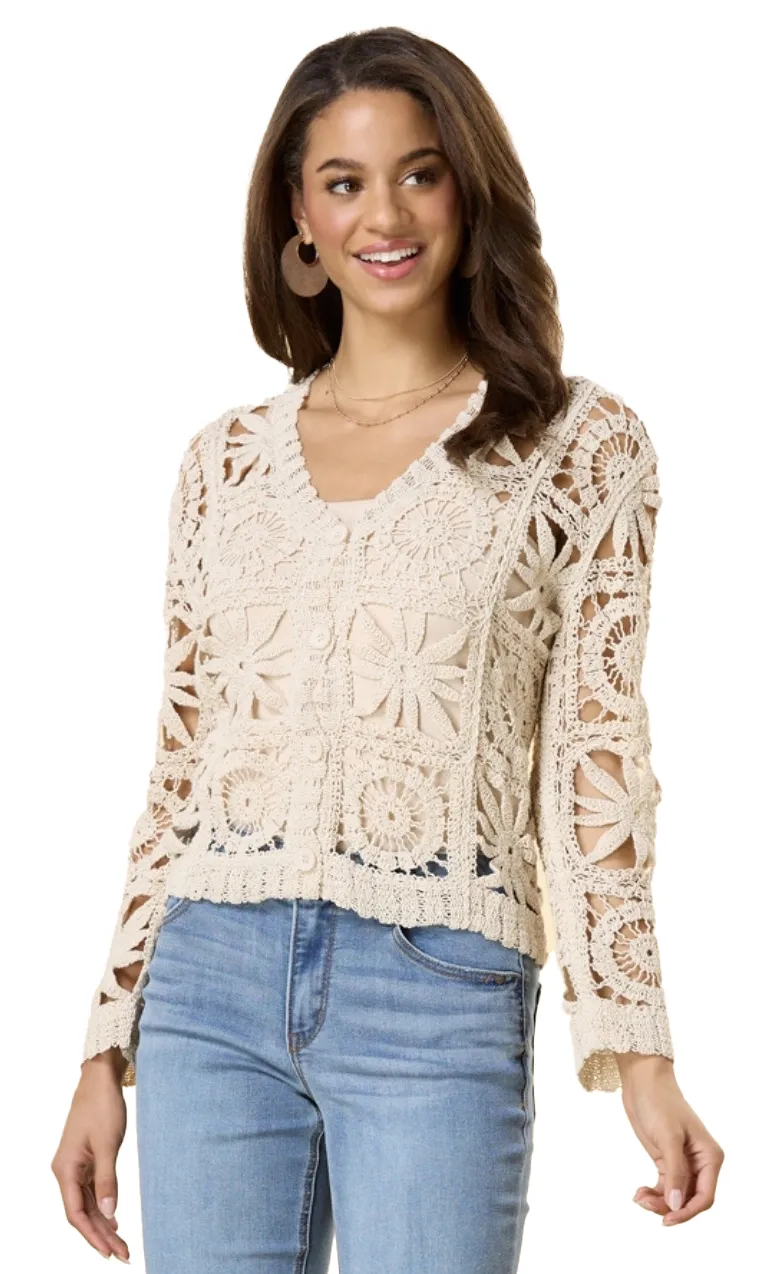 A Ninety Clothing Co. cream crochet cardigan with jeans